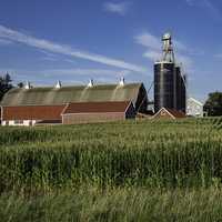 Cloud streaks over the farmhouse landscape