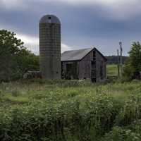 Grey-blue Skies with Barn and crops