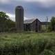 Grey-blue Skies with Barn and crops