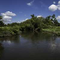 Landscape of he Sugar River under blue skies