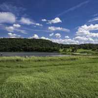 Landscape with blue sky and clouds with green grass at Indian lake
