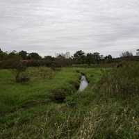 Little stream in the cloudy landscape