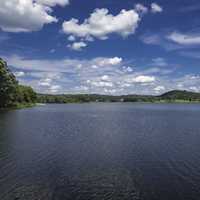 Long view of the landscape of Indian Lake with sky and clouds
