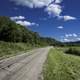 Road into Hogback Prairie under blue skies in Wisconsin