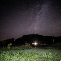 Stars behind the house and hills at Hogback Prairie