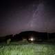 Stars behind the house and hills at Hogback Prairie