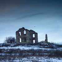 Abandoned Building in the winter in Wisconsin with Drone in Sky