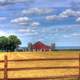 Farmhouse in the landscape with clouds in Southern Wisconsin