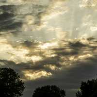 Dramatic Skies at sunset with clouds and sun rays