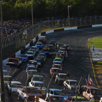 Many cars racing on a track