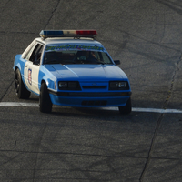 Old police car spinning in turn