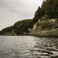 Rocky Shoreline with trees and Autumn Leaves