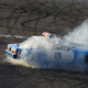 Spinning of old police car burning rubber