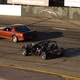 Two cars racing around the track