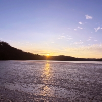 Sunset over the icy lake at Yellowstone Lake State Park