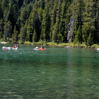 Canoeing under the trees on string lake