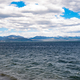 Across the waters  of Yellowstone Lake and mountains