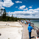 People on the walkway under the clouds by Yellowstone Lake