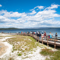 Walkway Tourists under sky and clouds landscape