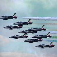 Jet Aircraft with colorful exhaust during an airshow