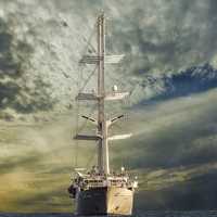 Battleship under the skies and clouds sailing