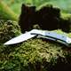 Folding Knife on a rock